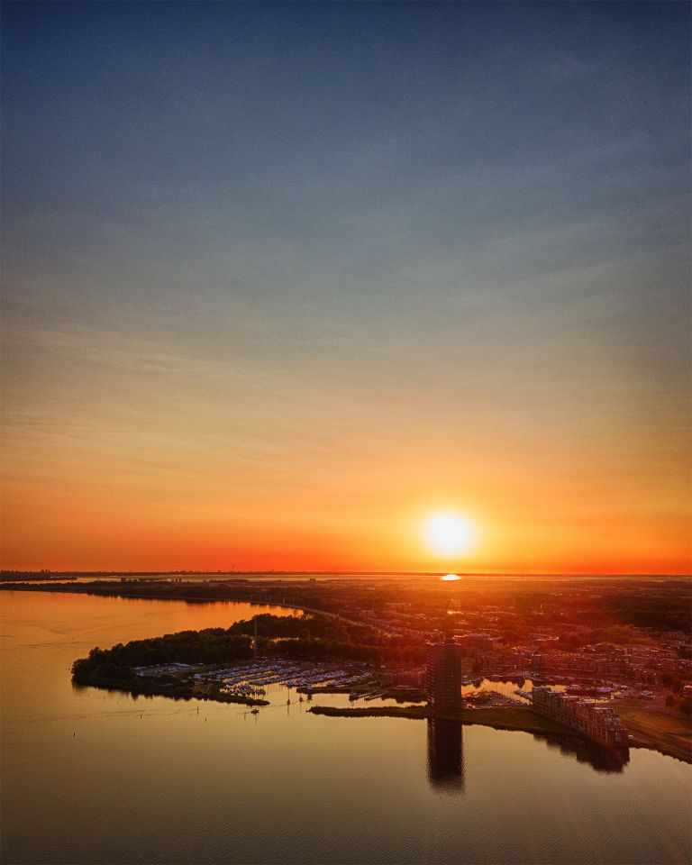 Drone sunset over lake Gooimeer