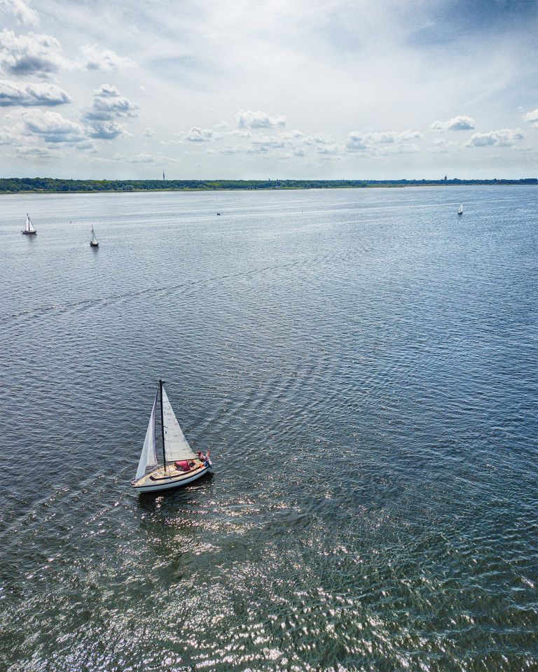 Sailing boats on lake Gooimeer