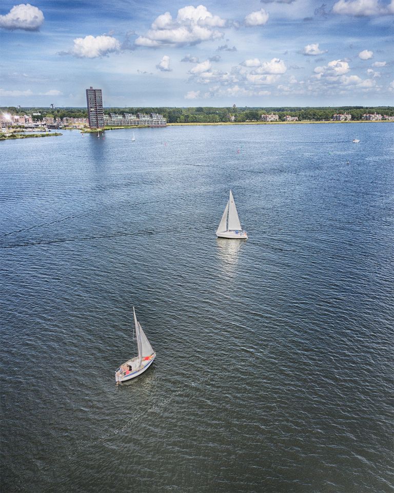 Sailing boats on lake Gooimeer