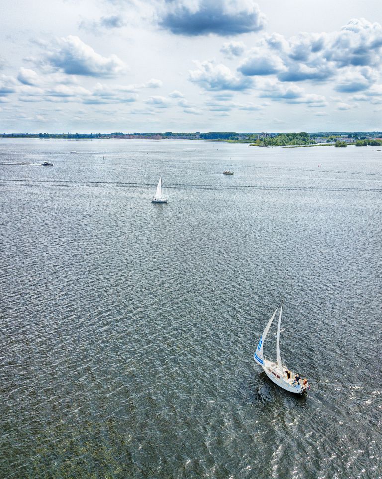 Sailing boats on lake Gooimeer