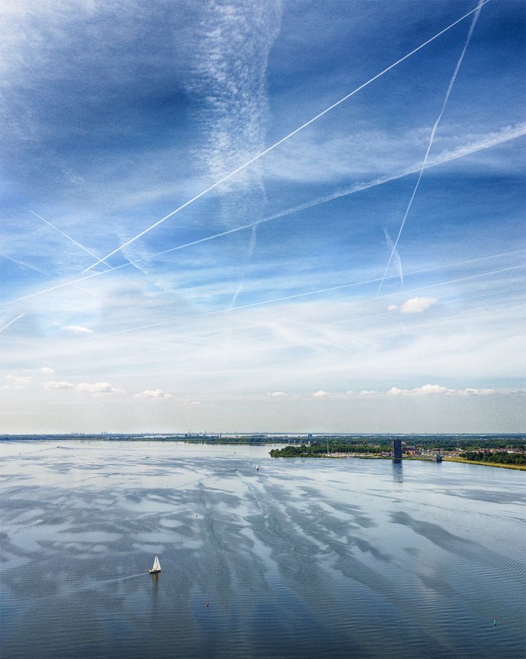 Drone picture of sailing boat on lake Gooimeer