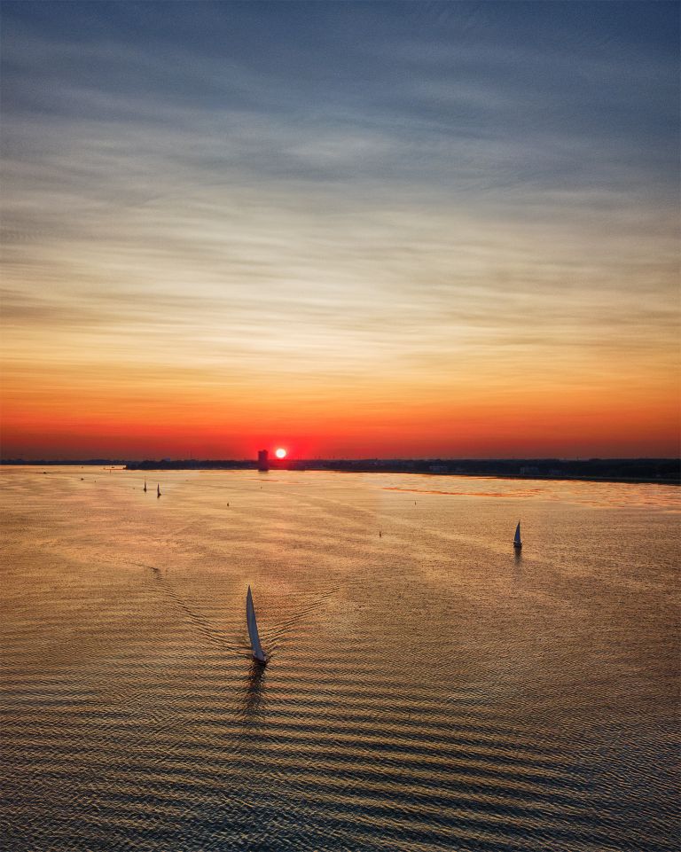 Sailing during sunset on lake Gooimeer