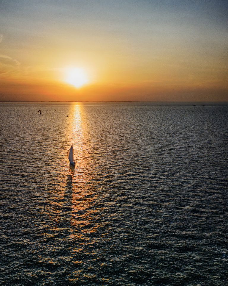 Sailing boat on lake Markermeer during sunset