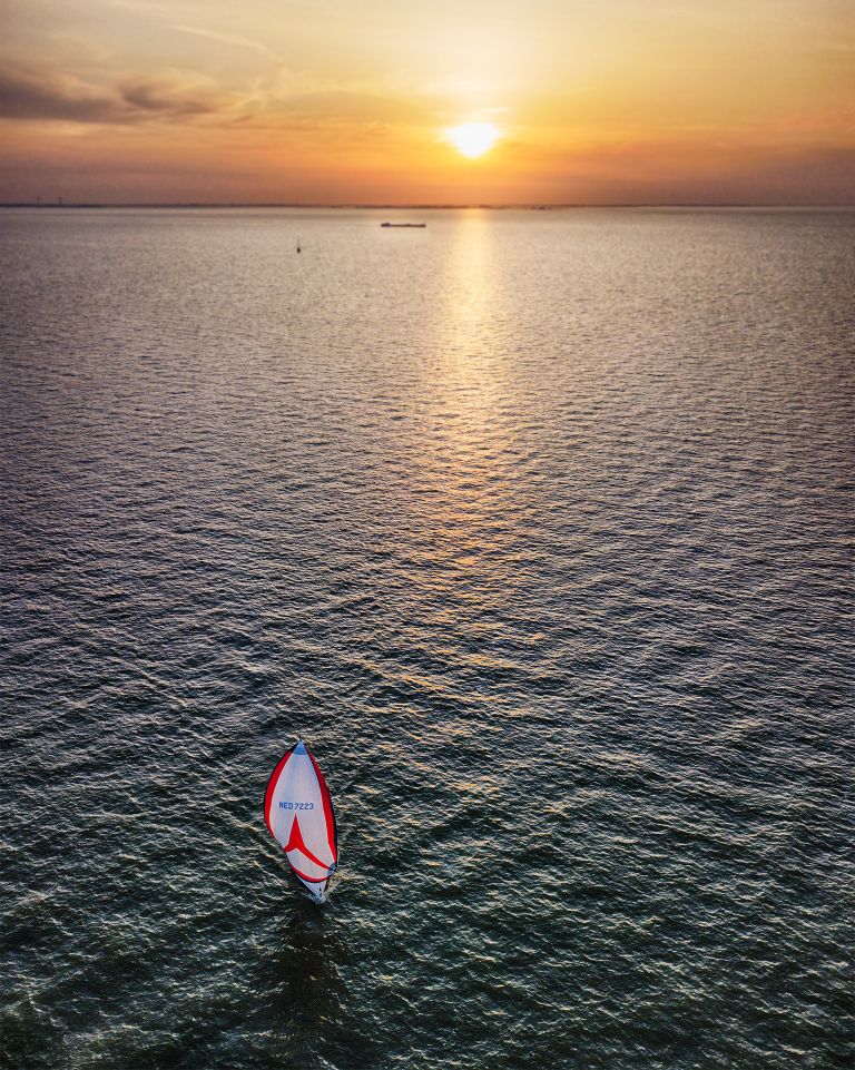 Sailing on lake Markermeer during sunset