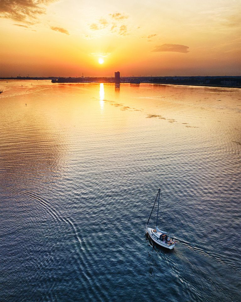 Sailing on lake Gooimeer during sunset