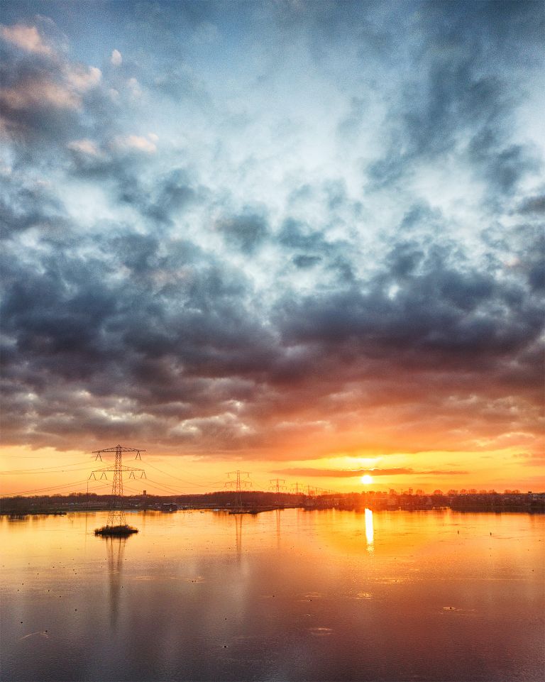 Power lines over lake Weerwater from my drone during sunset