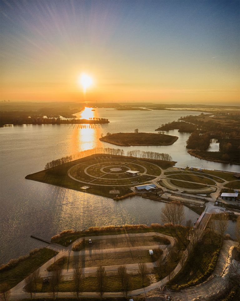 Drone sunset of camping Waterhout next to lake Noorderplassen