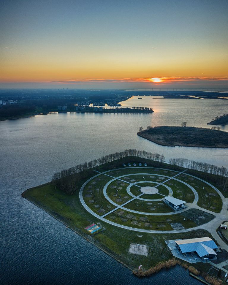 Drone sunset of camping Waterhout next to lake Noorderplassen