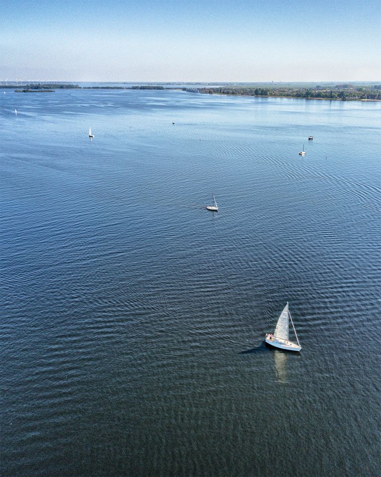 Sailing boats on lake Gooimeer