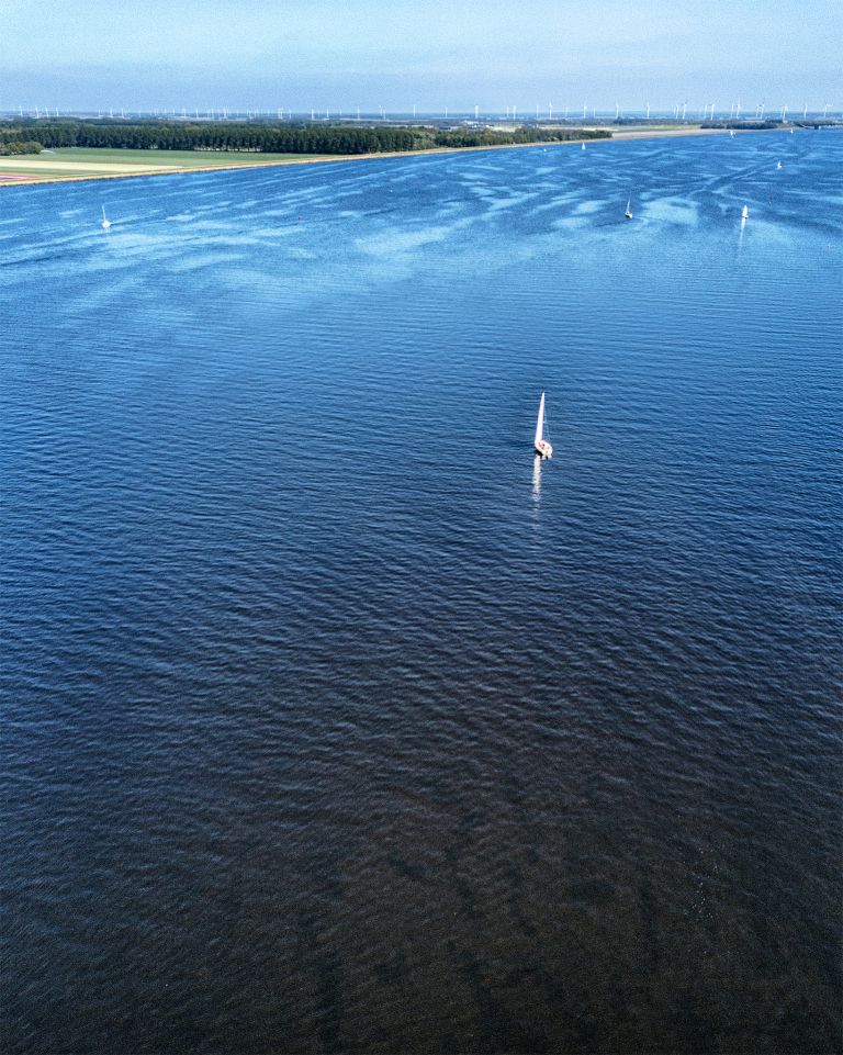 Sailing boats on lake Gooimeer