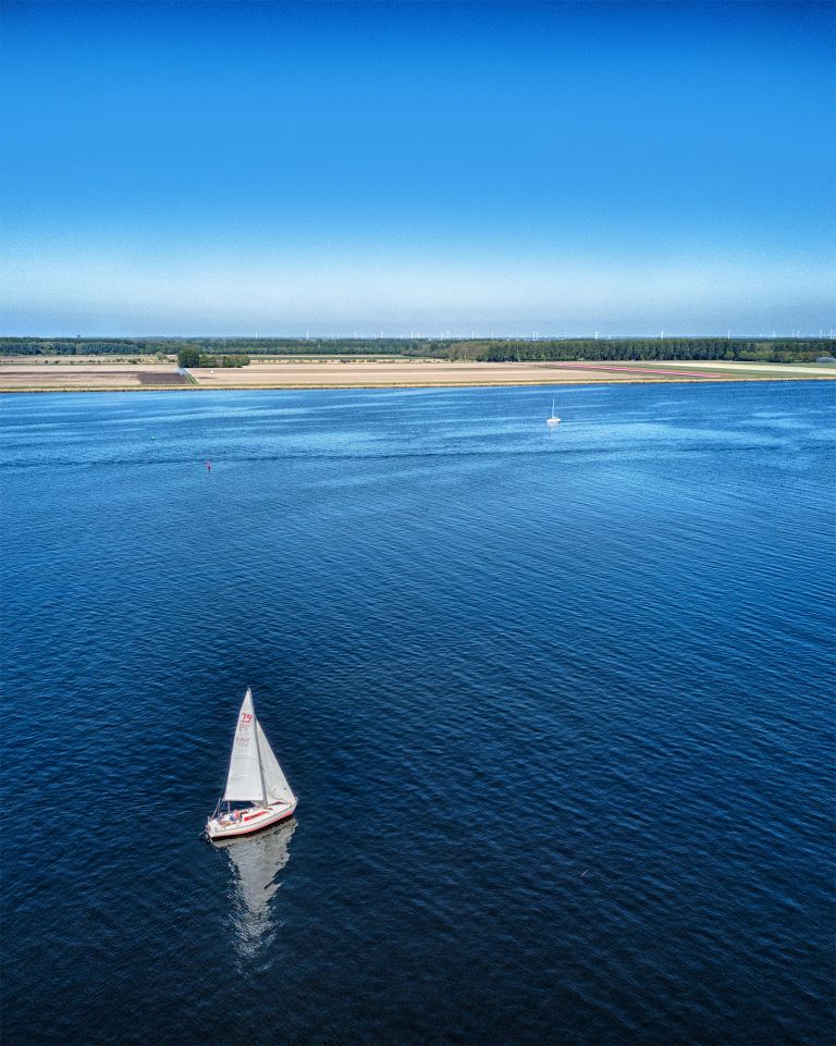 Sailing boats on lake Gooimeer