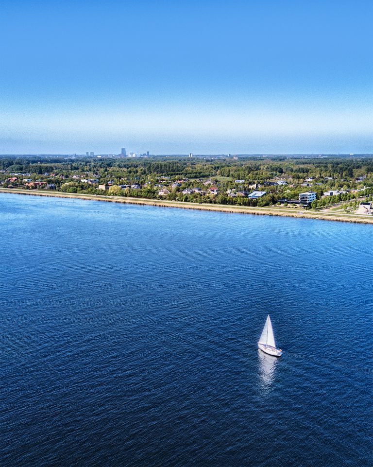 Sailing boats on lake Gooimeer