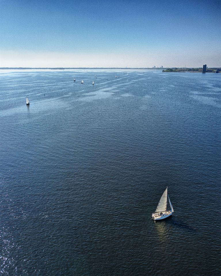 Sailing boats on lake Gooimeer