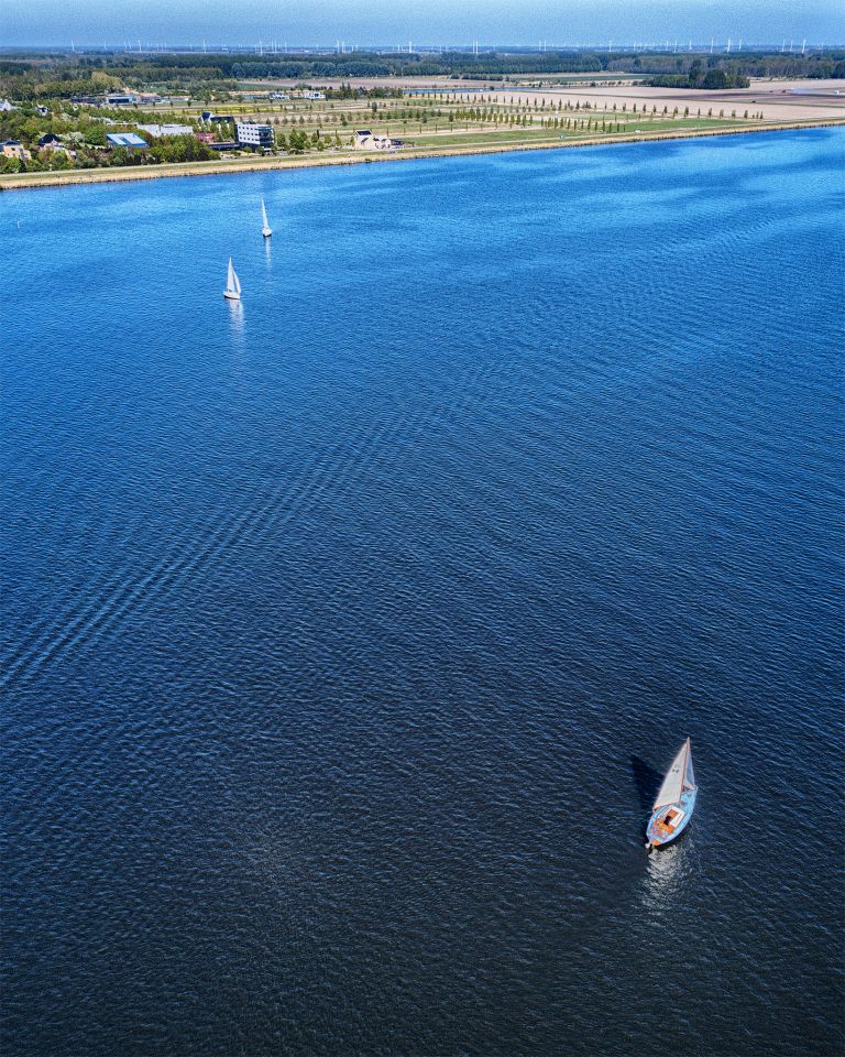 Sailing boats on lake Gooimeer