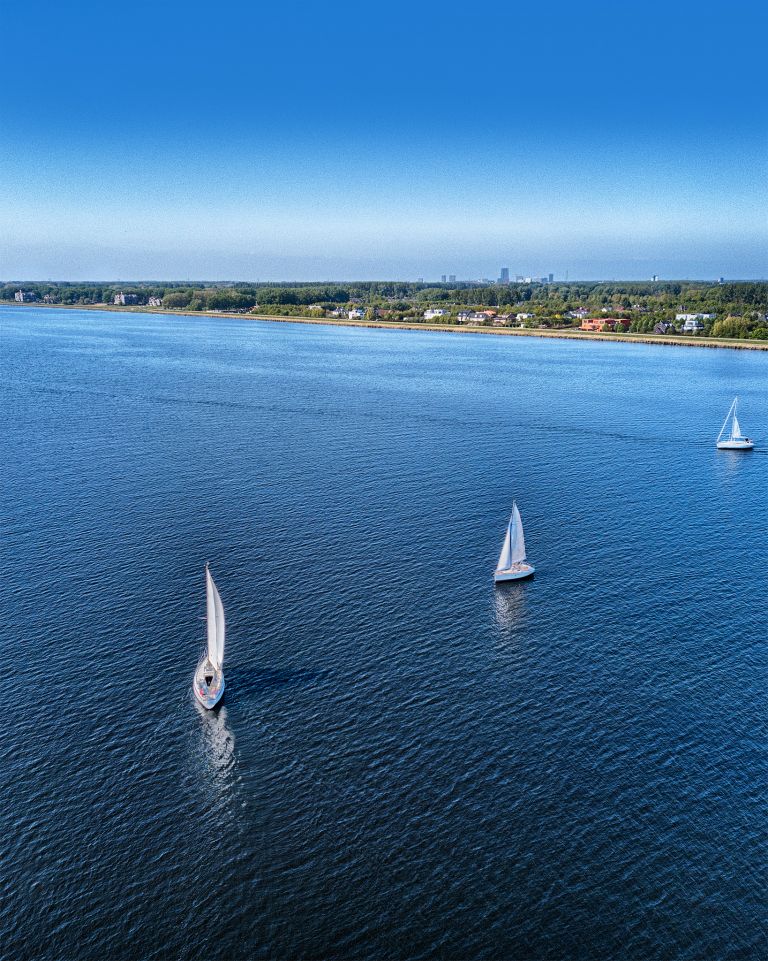 Sailing boats on lake Gooimeer