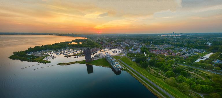 Drone sunset panorama over lake Gooimeer