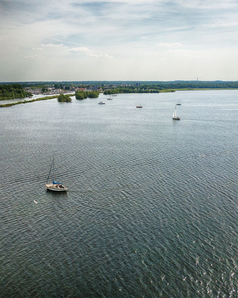 Sailing boats on lake Gooimeer