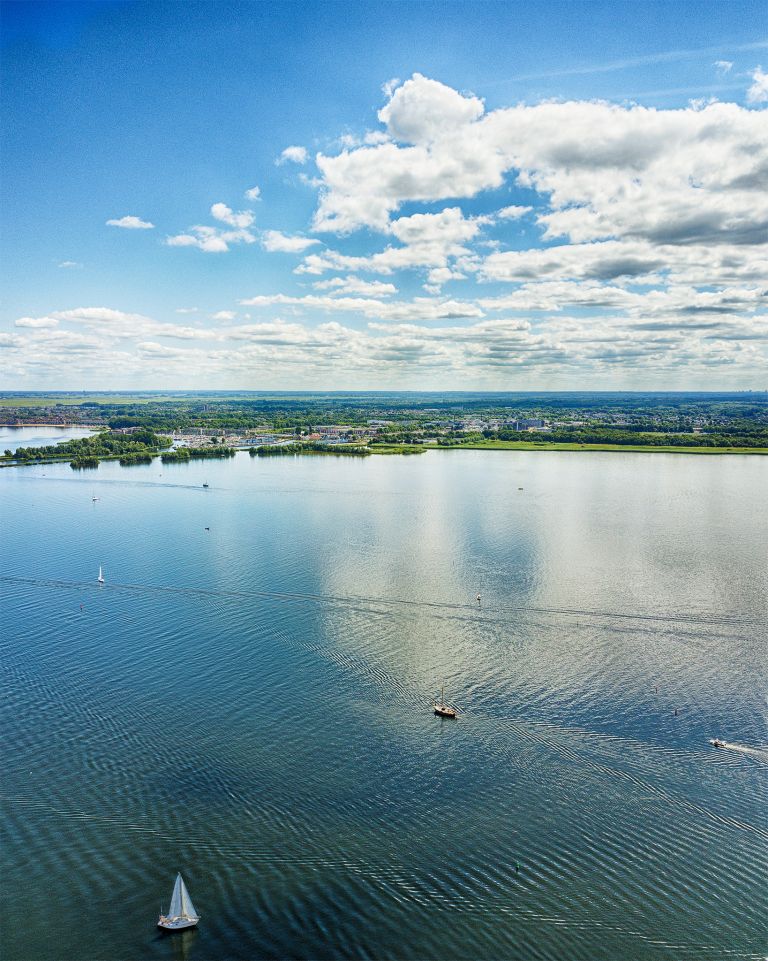 Boats on lake Gooimeer on a summer day