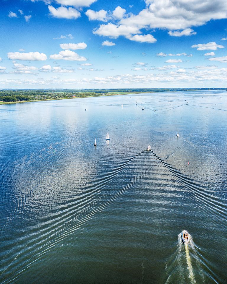 Boats on lake Gooimeer on a summer day