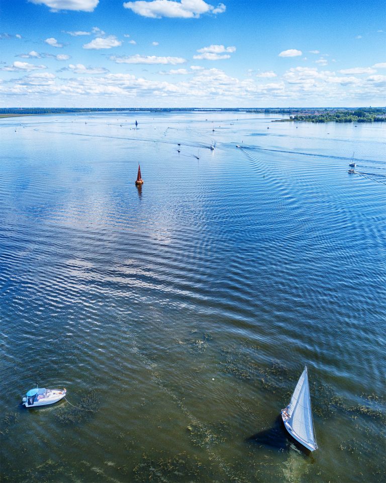 Boats on lake Gooimeer on a summer day