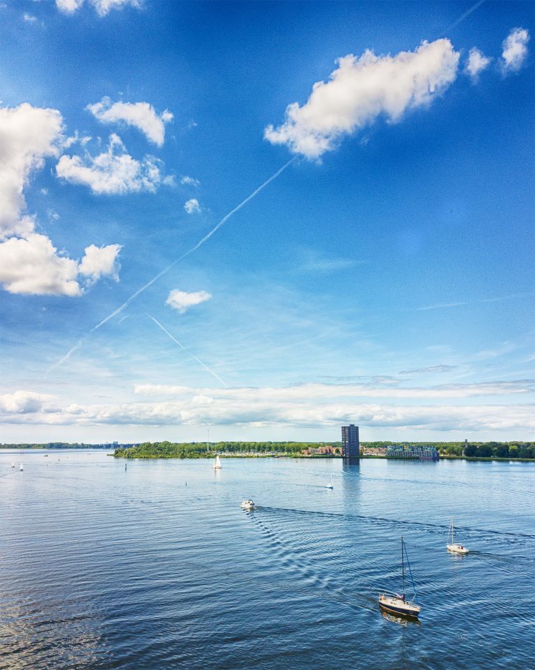 Boats on lake Gooimeer on a summer day