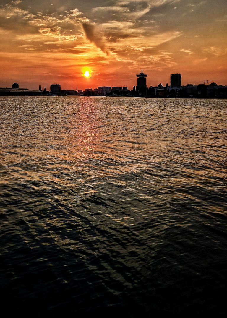 Sunset over the IJ river in Amsterdam